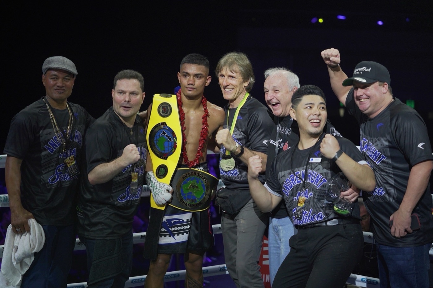 Gary Chen with the championship corner team as Andrew Hunt holds the title belt