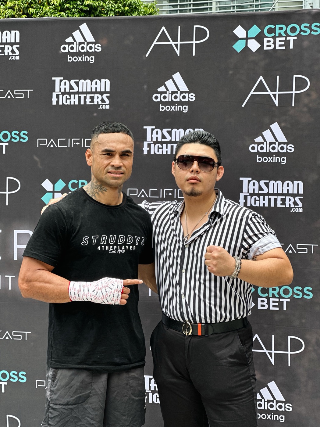 Gary Chen alongside champion Leti Leti at the official fight-night face-off