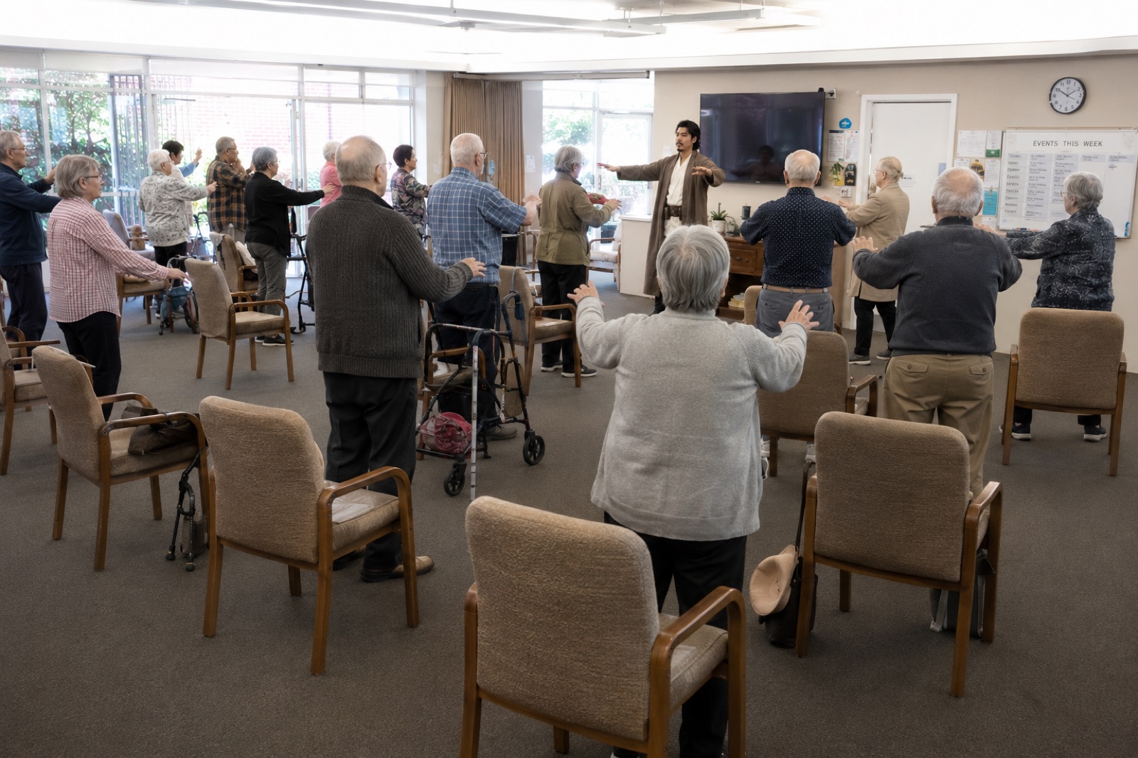 Gary Chen leading a Physio-Qi group movement session for older adults in an aged-care setting